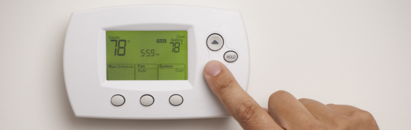 Home thermostat on a wall